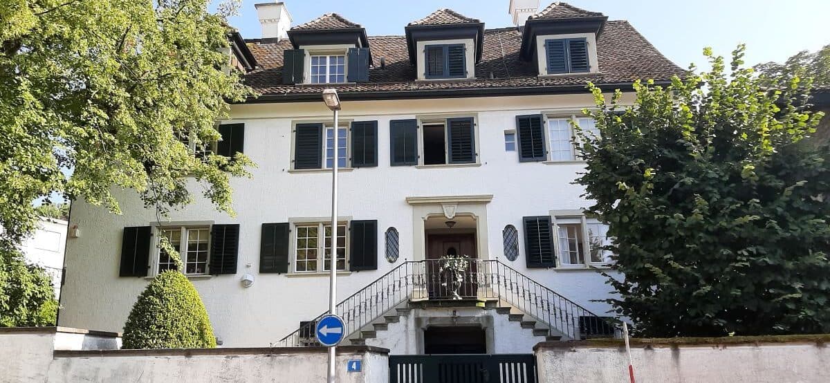 The house in Zollikon where the first congregation met, which carries a plaque